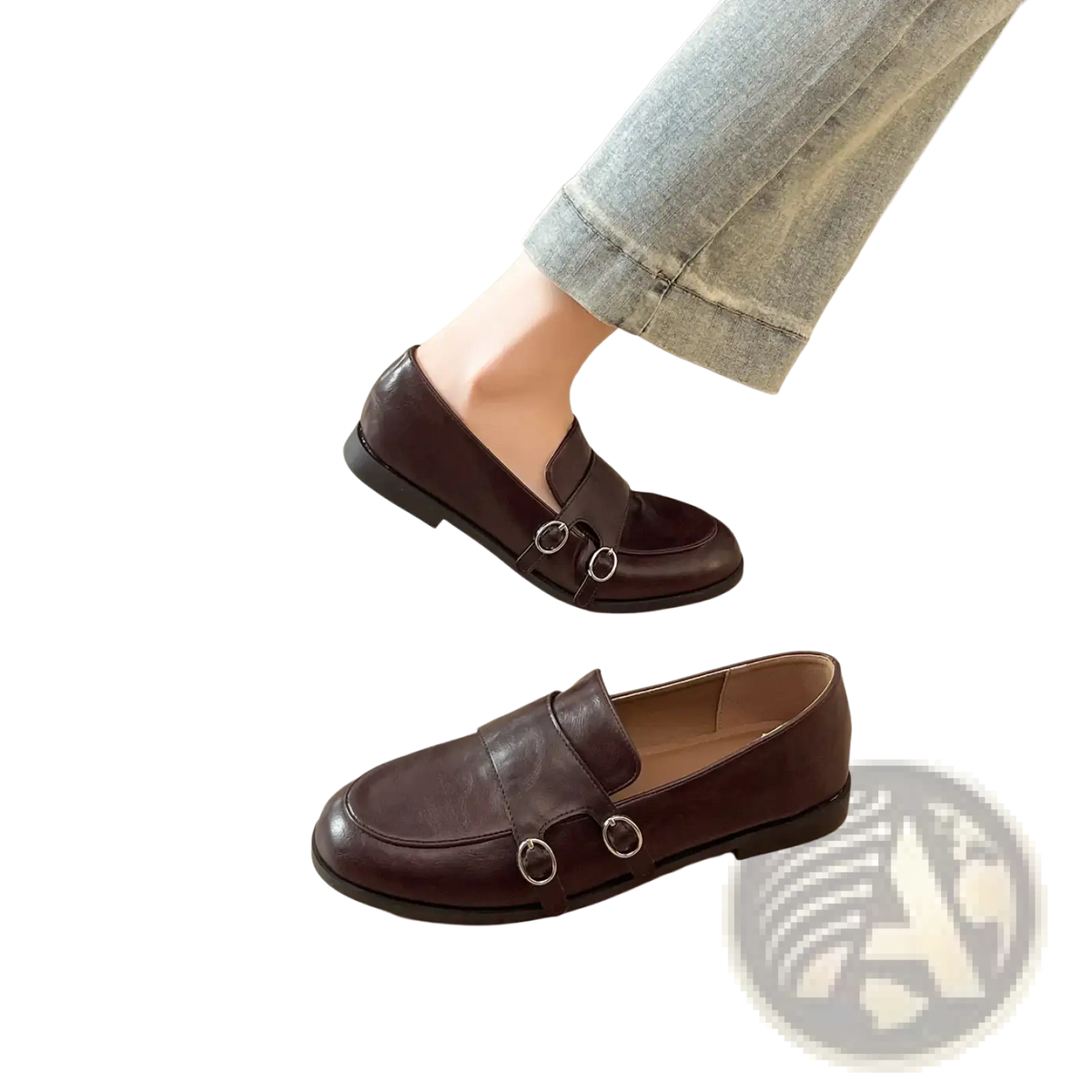 Dark brown leather loafers with classic design featuring two silver-toned circular buckles on the front