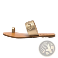 Black leather flat sandals with gold-toned metallic strap logo and tan leather sole featuring toe loop design