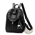 Black leather school backpack with a small black and white bear charm hanging from the front zipper