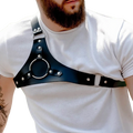 Black leather studded dance harness with silver buckles and central circular ring made of metal hardware