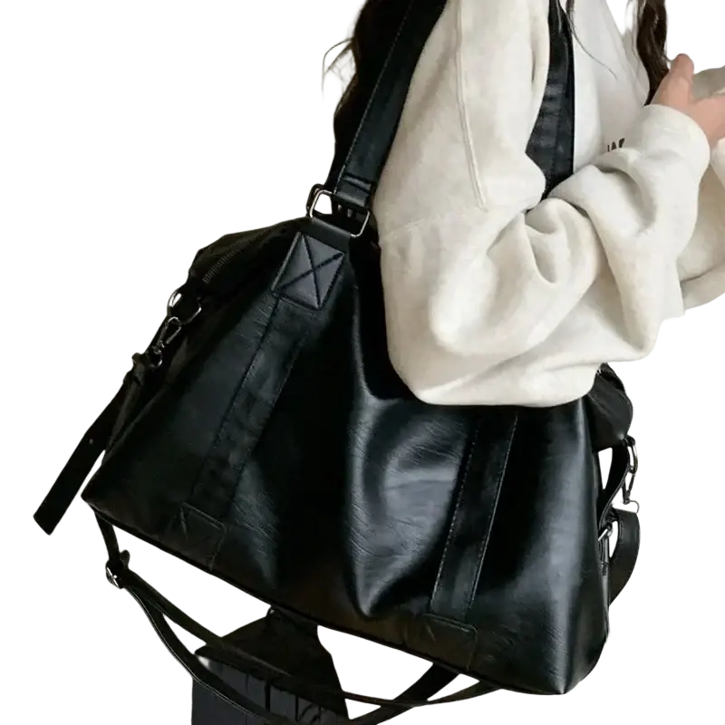 Black faux leather duffle bag with reinforced stitching adjustable straps zipper hidden bag width 40cm thickness 14cm