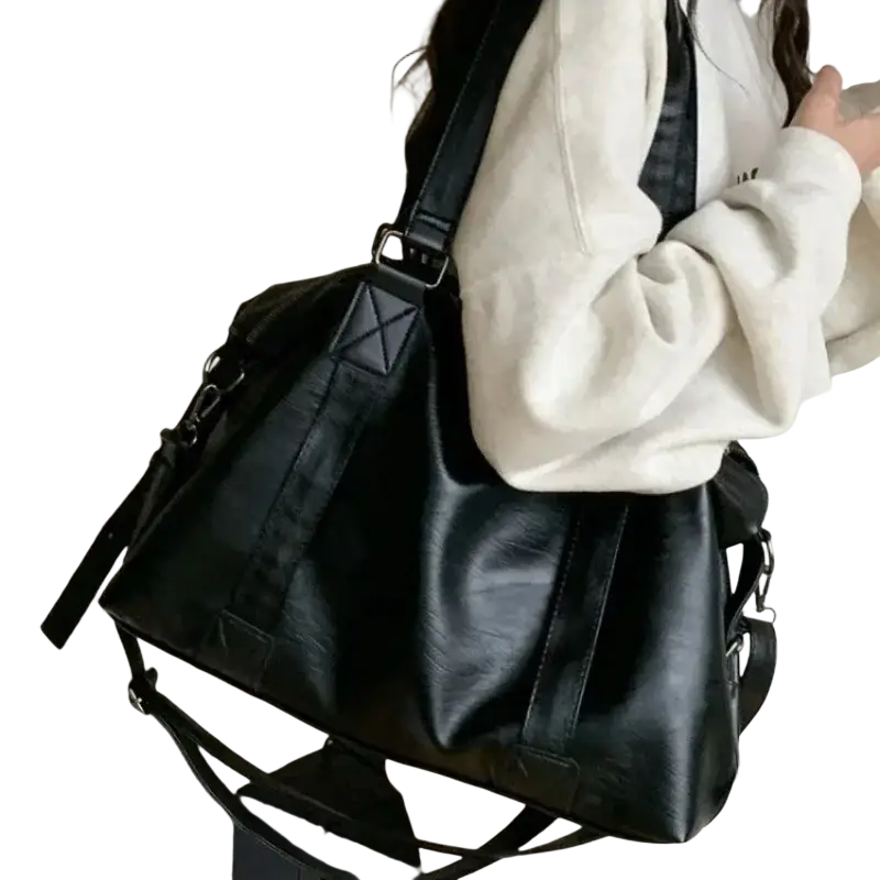 Black faux leather duffle bag with zipper hidden bag design, width 40cm thickness 14cm, reinforced stitching and adjustable straps