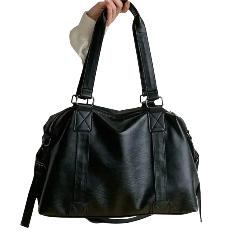 Black leather tote bag with 40cm thickness 14cm featuring structured black faux leather and reinforced straps with zipper hidden bag