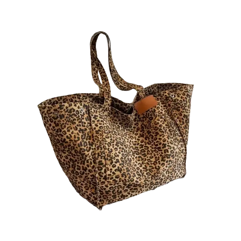 A tan and brown leopard print canvas tote bag with a leather patch and 40cm thickness 14cm zipper hidden bag