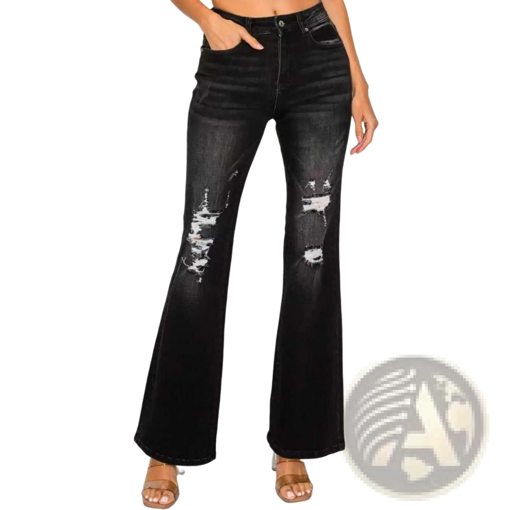 Black low rise distressed flared denim jeans with ripped knee details and a worn black finish