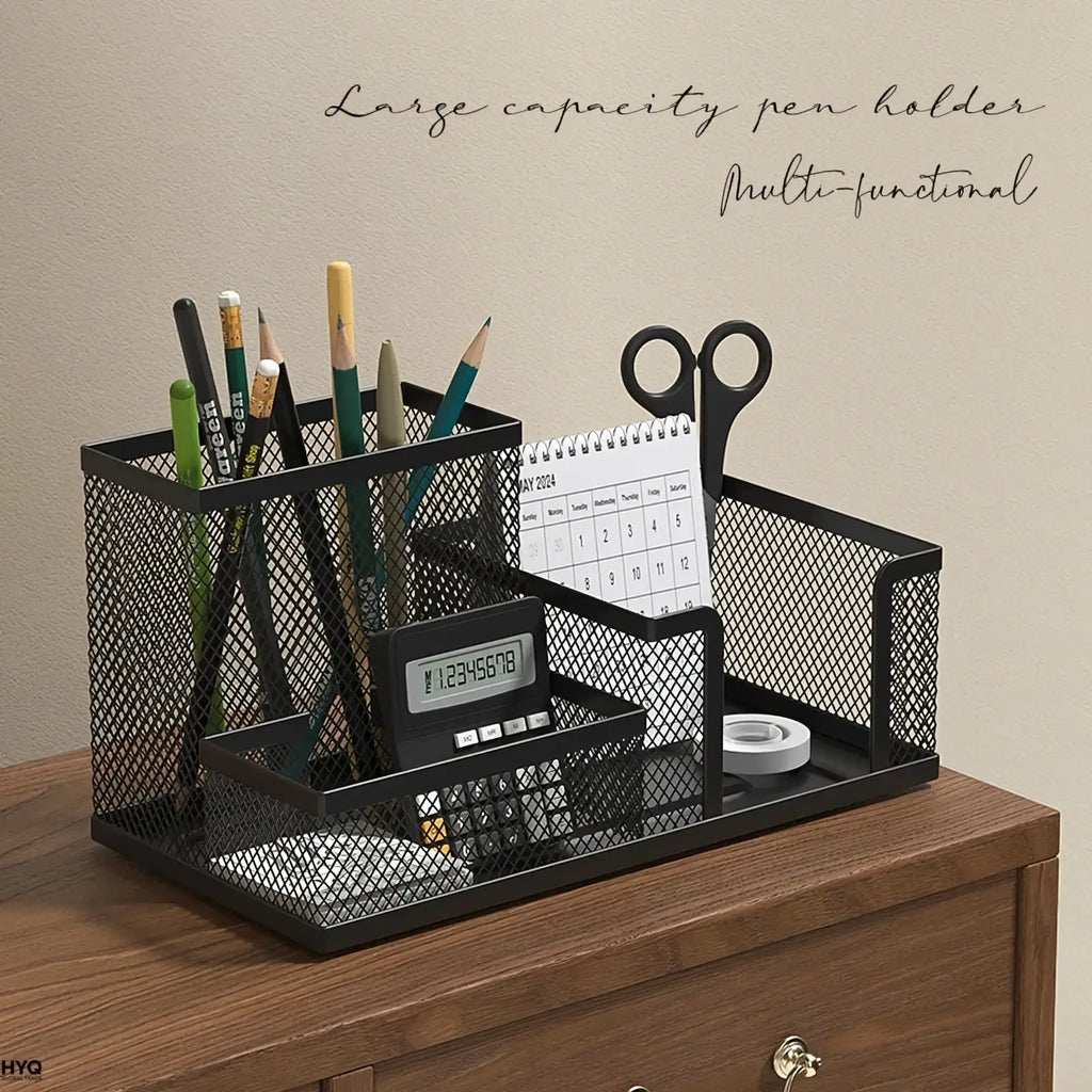 Black mesh desk organizer and pen caddy with multiple compartments holding pens scissors calculator and calendar