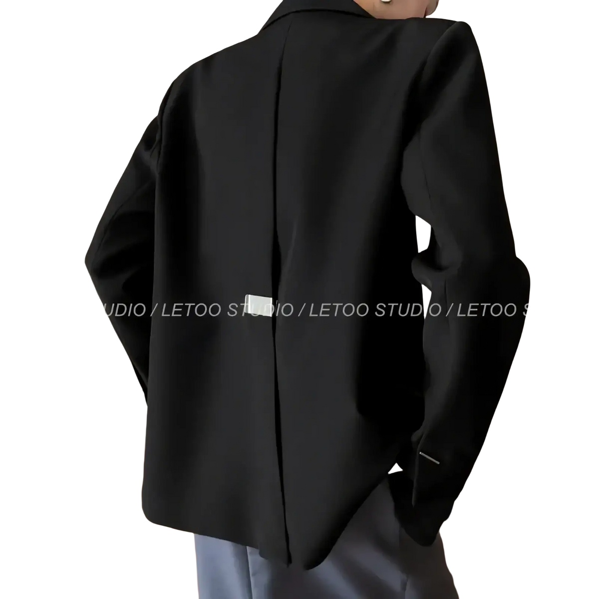 Black minimalist women blazer in sleek modern design with subtle back seam detail shown from the back side