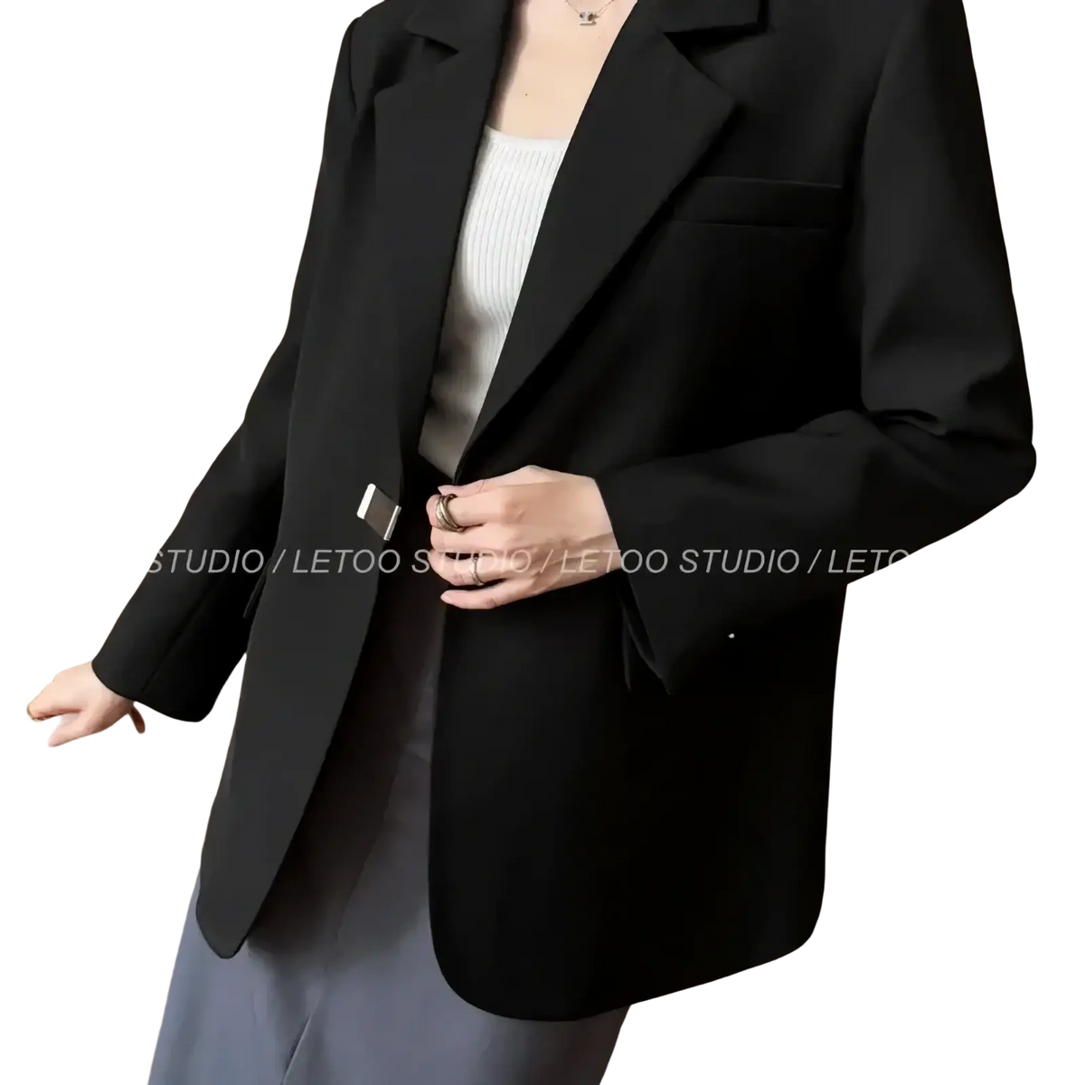 Black minimalist women blazer in sleek tailored fit with notched lapels for a polished professional look