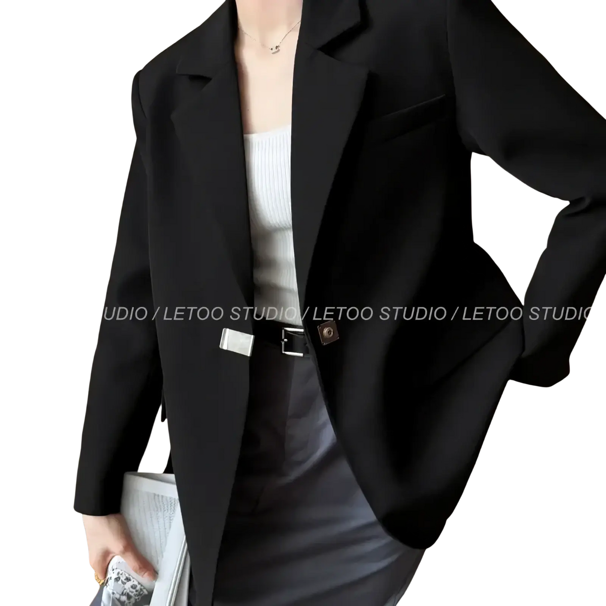 Black minimalist women blazer in sleek tailored fit with structured lapels for a polished professional look