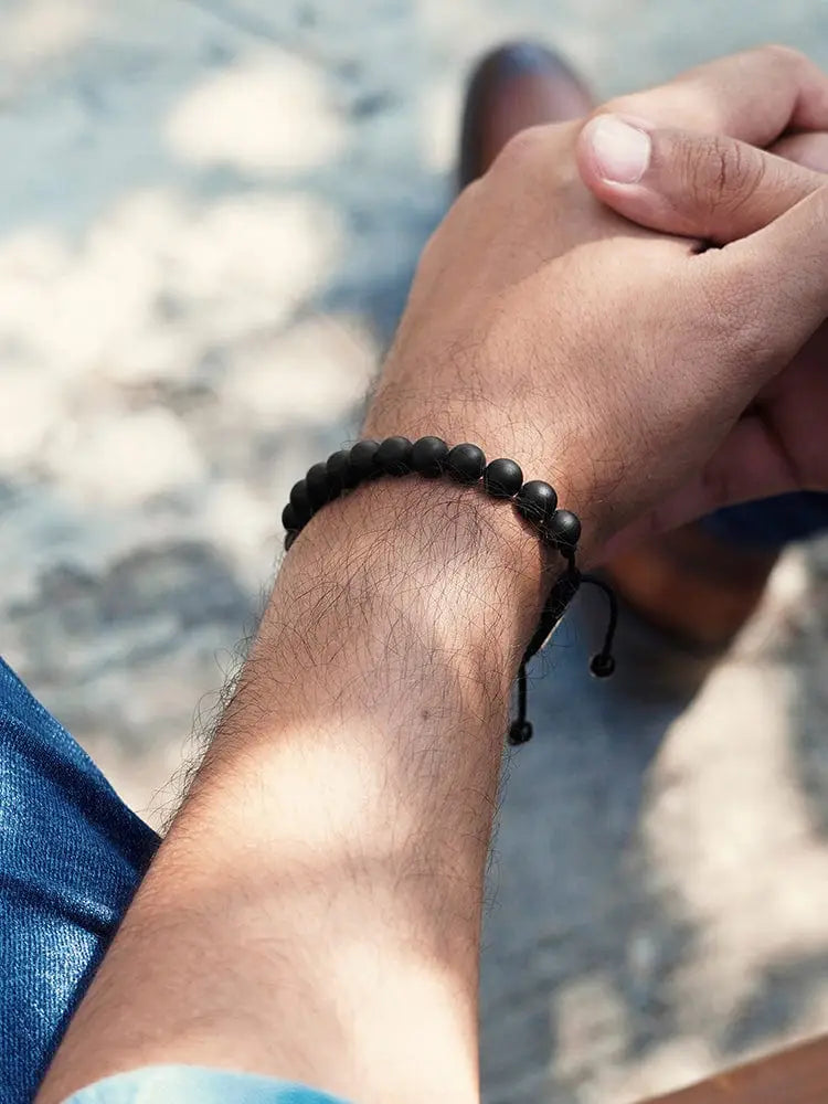 Handcrafted matte black onyx beaded bracelet with a simple adjustable design and steel clasp
