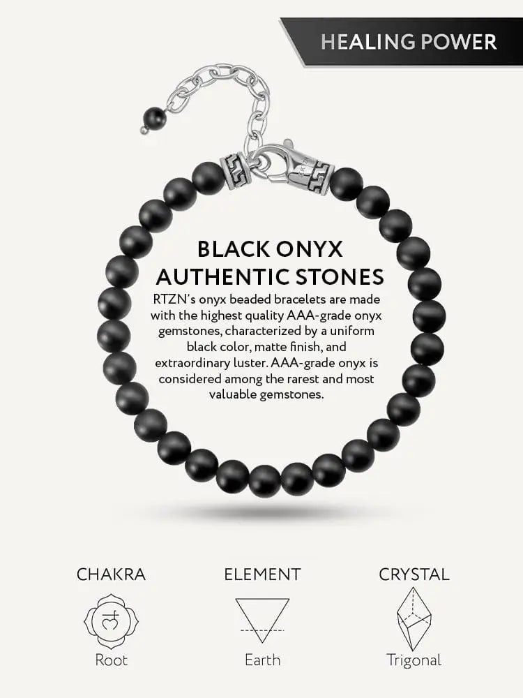 Matte black onyx beaded bracelet with greek key accents and a silver-toned clasp and chain visible on the back side