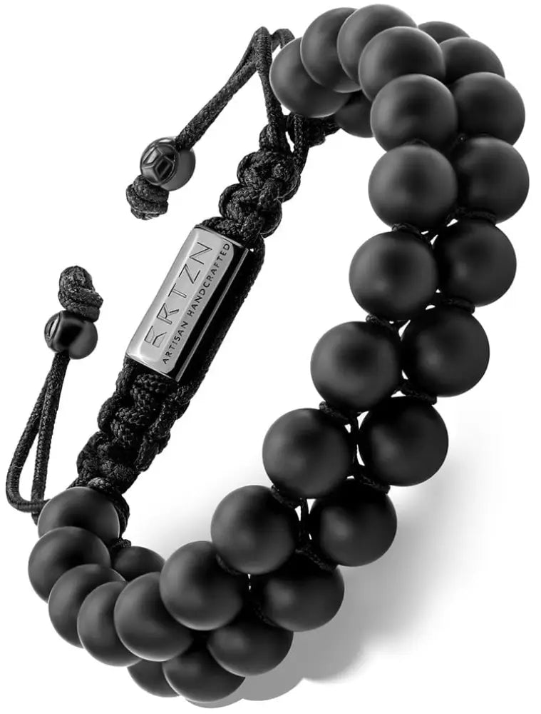 Handcrafted Morocco black onyx beaded bracelet with silver-toned metal plate engraved rtzn artisan handcrafted and adjustable cord closure