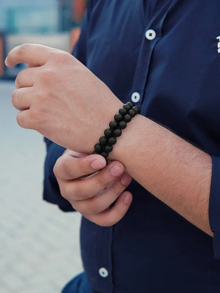 Handcrafted Morocco black onyx beaded bracelet with steel clasp worn on wrist showcasing its elegant design