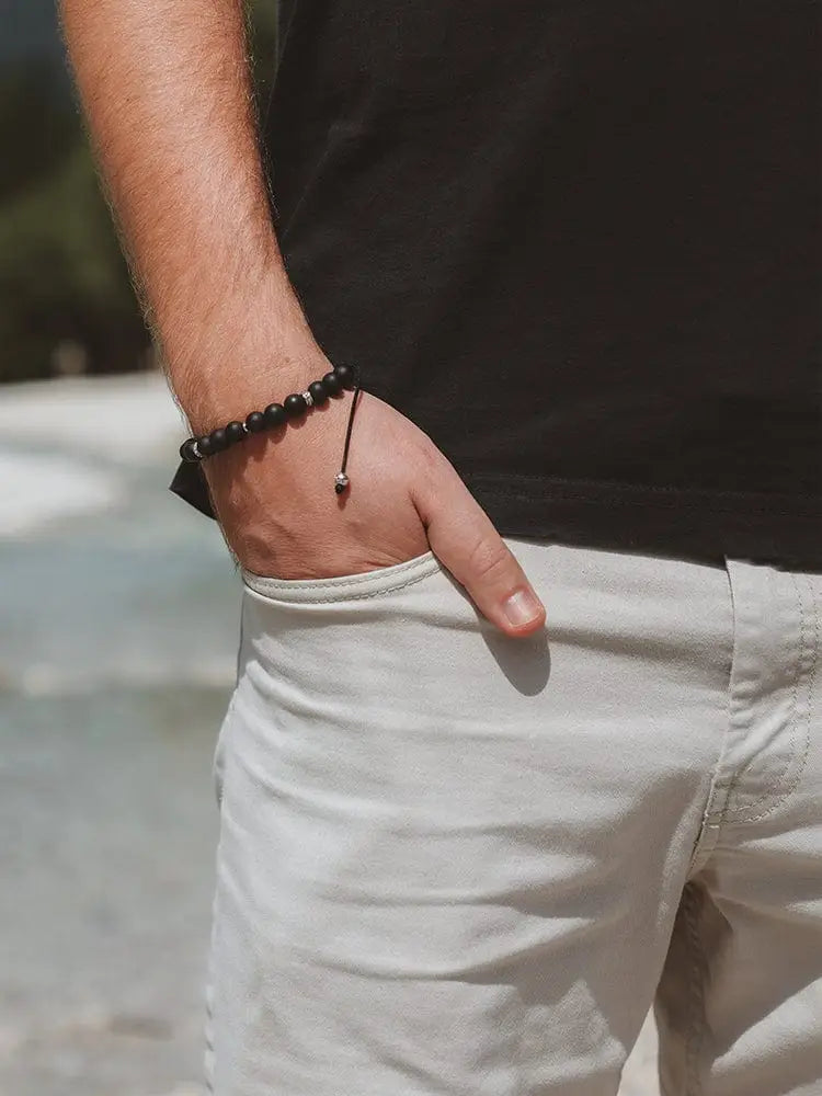 Mykonos black onyx beaded bracelet with black beads and a stainless steel silver accent bead