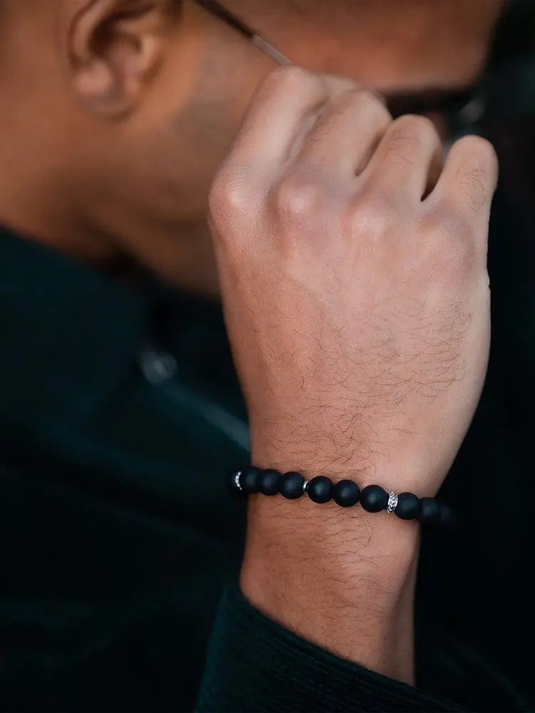 Mykonos black onyx beaded bracelet with stainless steel silver accent beads worn on wrist