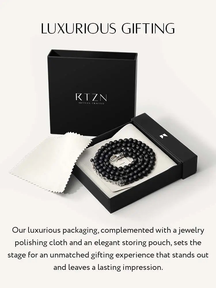 Black onyx beaded necklace with silver-toned 316l stainless steel clasp in an elegant black gift box