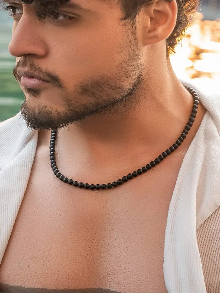 Black onyx beaded necklace made of 316l stainless steel worn around the neck for elegant style