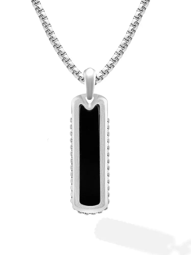 Silver dog tag pendant with black inlay and beaded edge detailing on a matching chain in 316l stainless steel