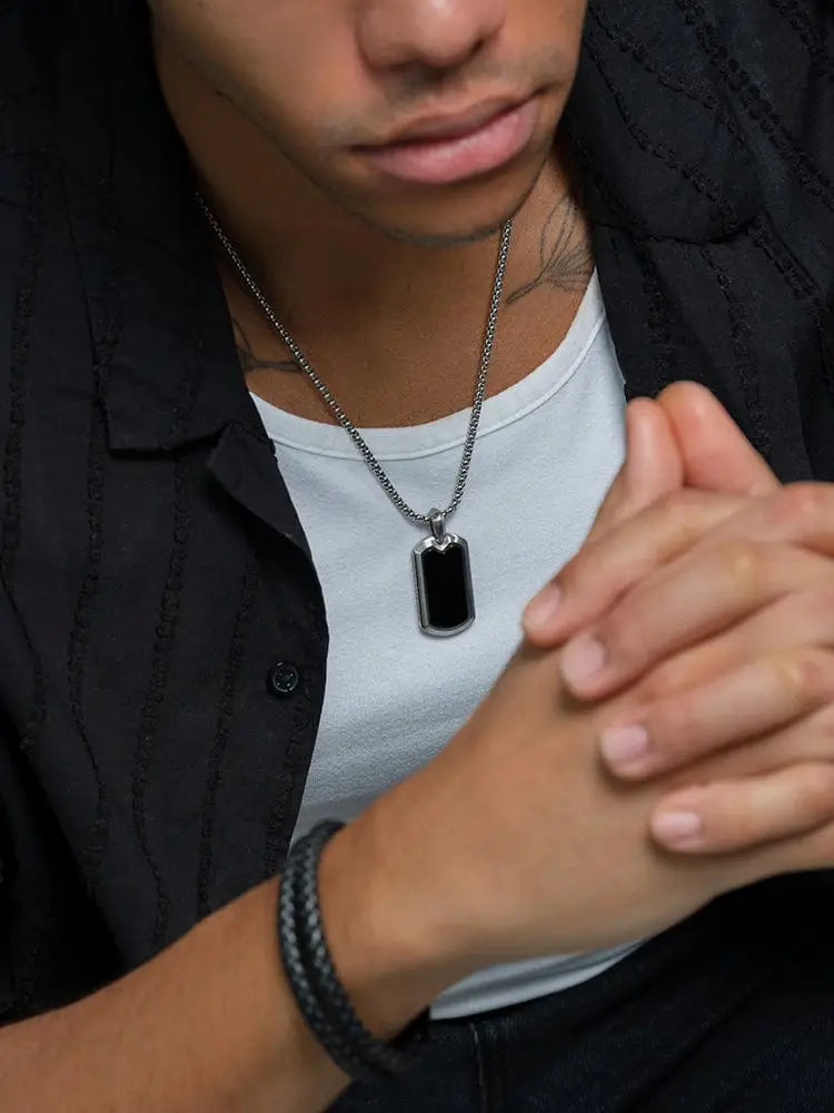 Silver stainless steel dog tag necklace with black onyx inset on a chain for stylish everyday wear