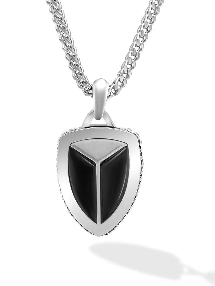 Silver shield pendant with black onyx center and textured edges on a matching 316l stainless steel chain