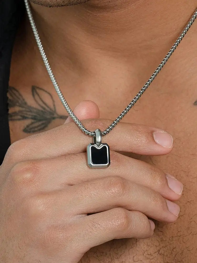 Silver chain necklace with a black onyx rectangular pendant in 316l stainless steel featuring a sleek modern design