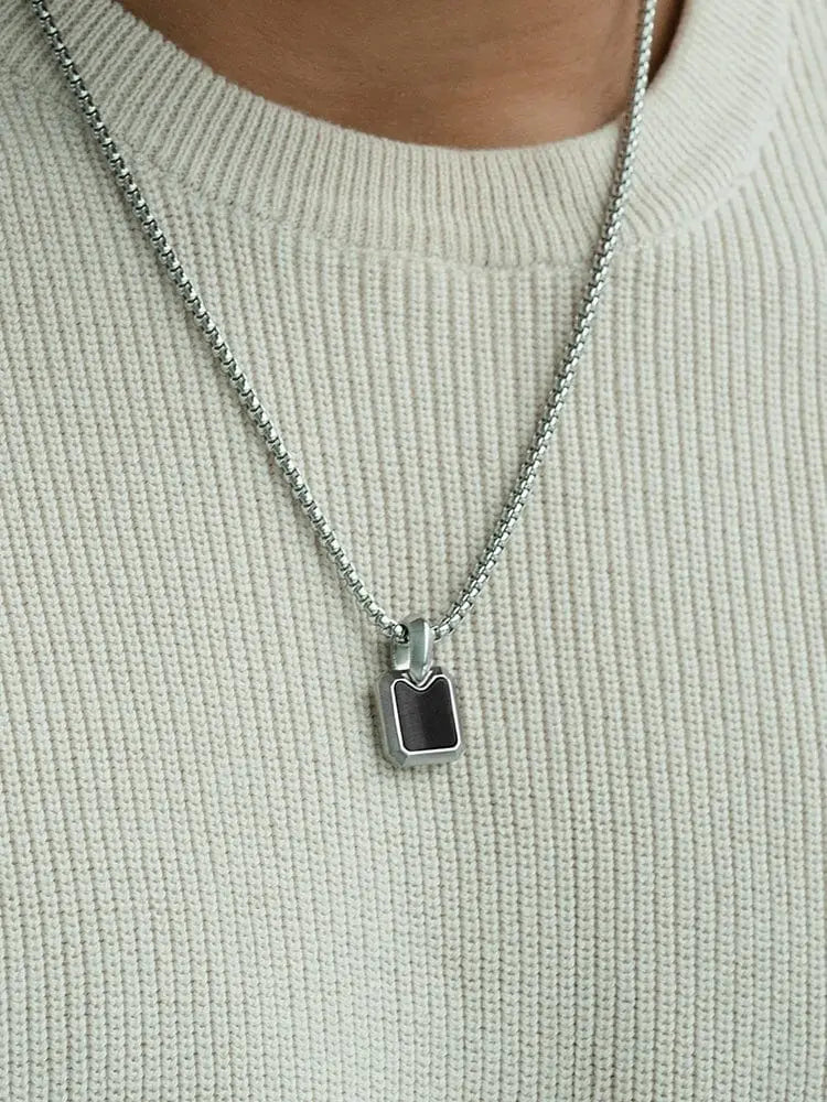 Silver chain necklace with black onyx rectangular pendant featuring black inlay and 316l stainless steel edges