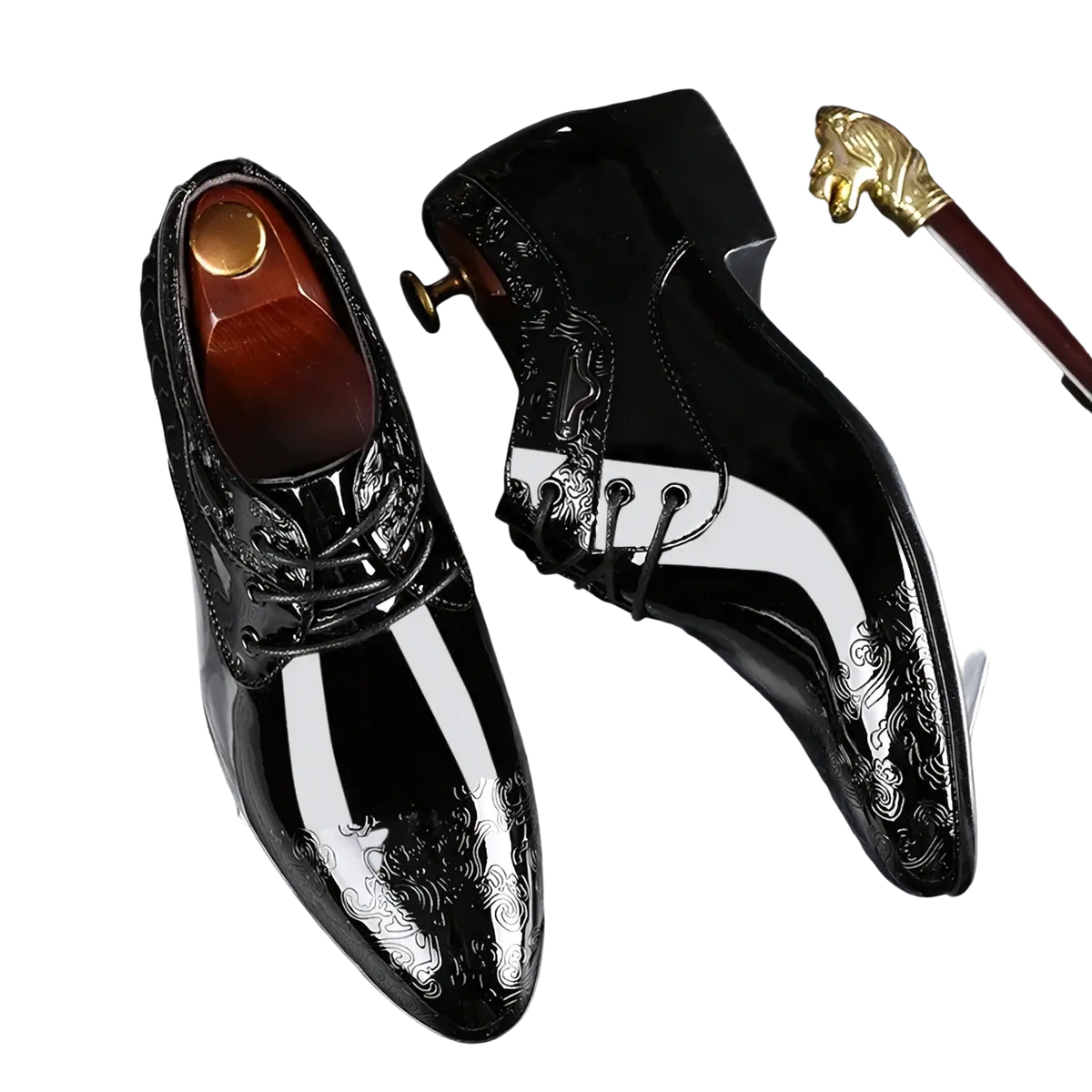 Black patent leather brogue oxford shoes with white stripe accents and intricate silver embossed patterns