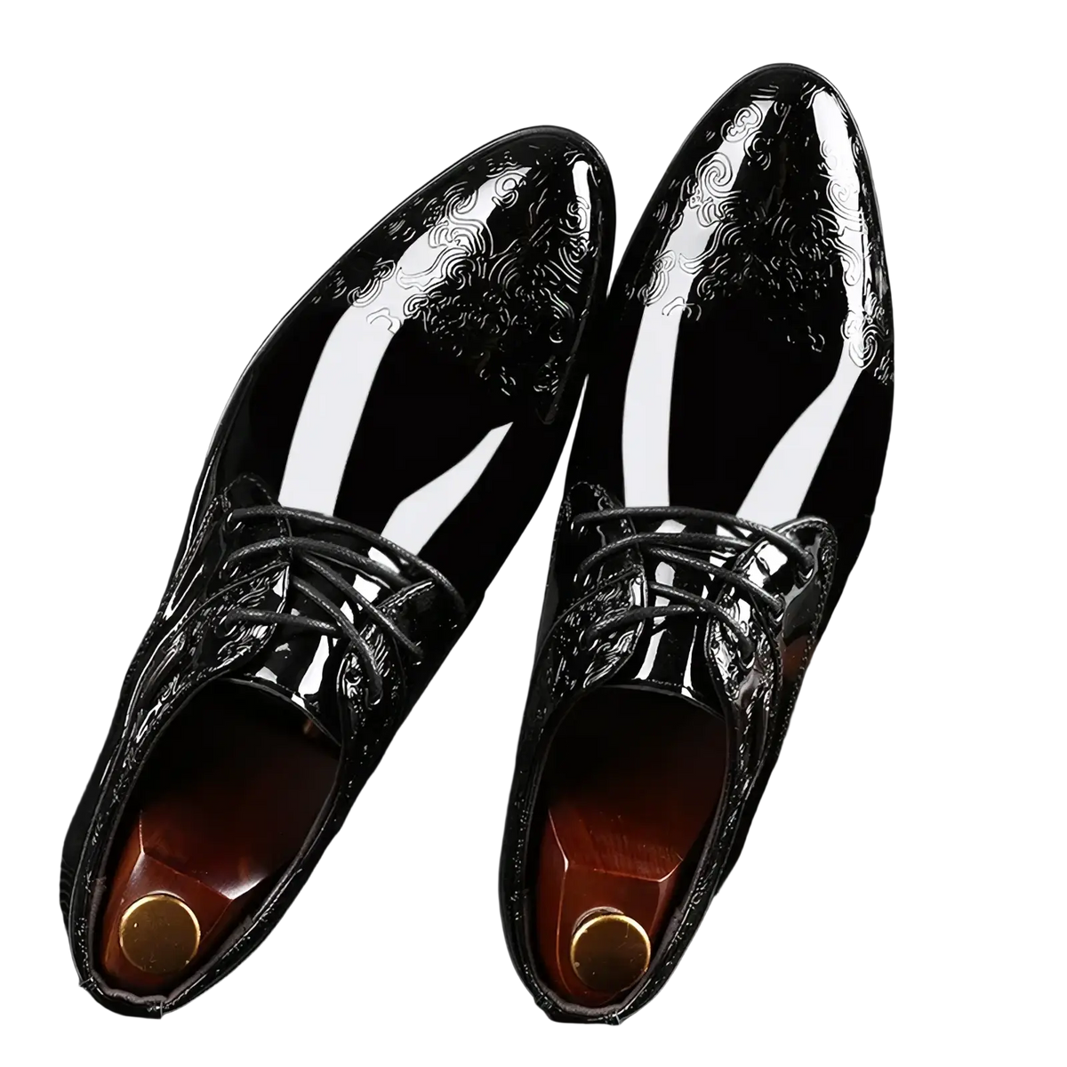 Black patent leather brogue Oxford shoes with glossy finish and intricate white swirl patterns on the toe cap