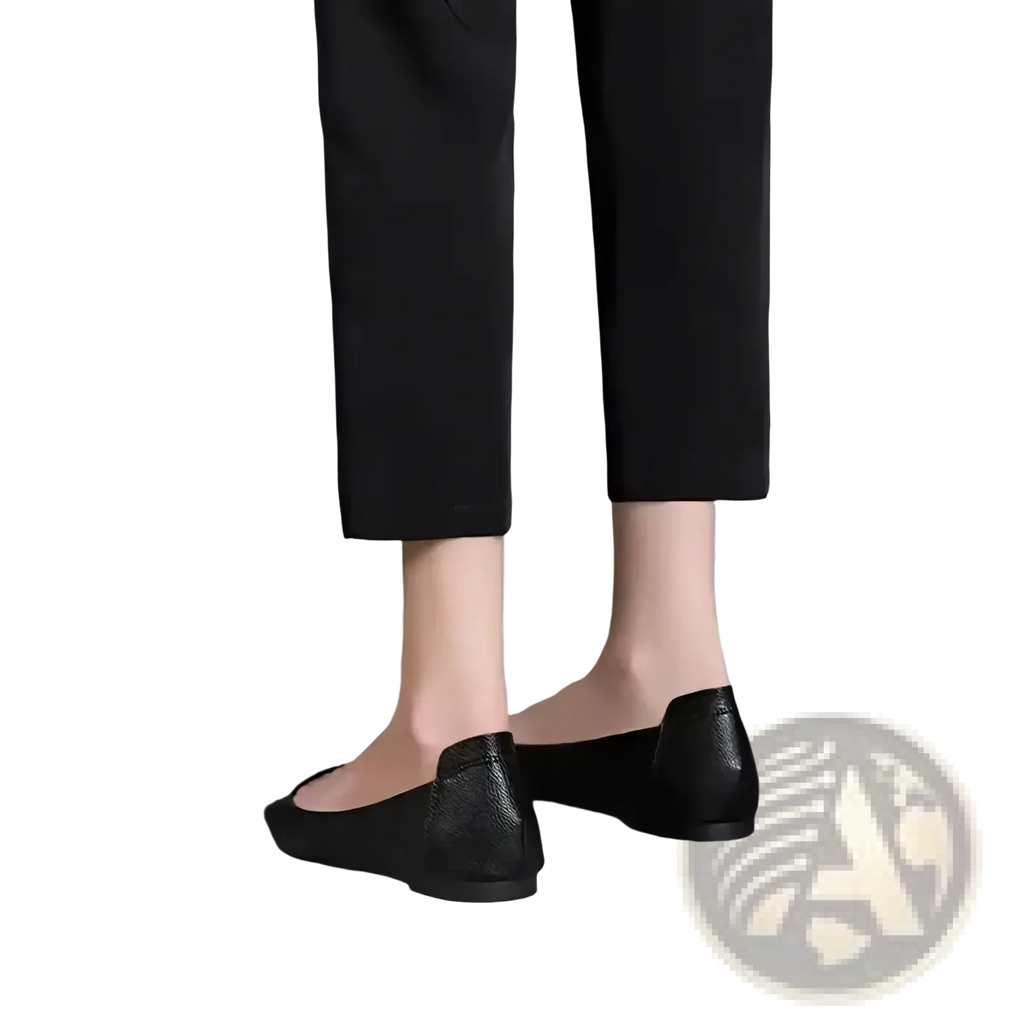 Black leather flat shoes with subtle textured finish and rounded toe design ideal for office wear