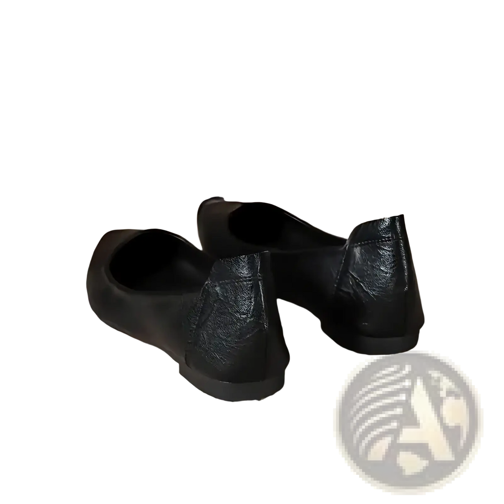 Black pointed toe leather office flats with a smooth glossy finish and subtle textured heel