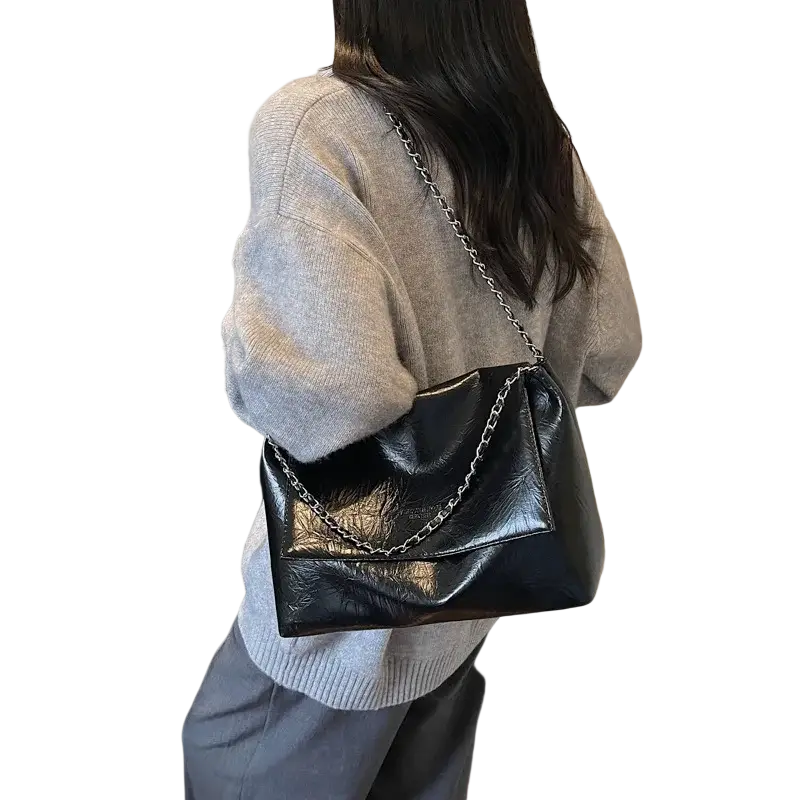 Black pu leather shoulder bag with silver chain strap featuring large capacity for stylish shoulder bags use