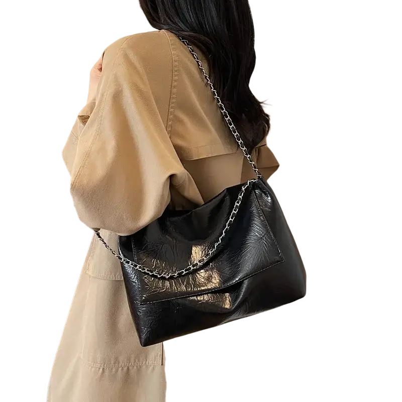 Black pu leather shoulder bag with large capacity features a black glossy leather finish and silver chain strap shoulder bags