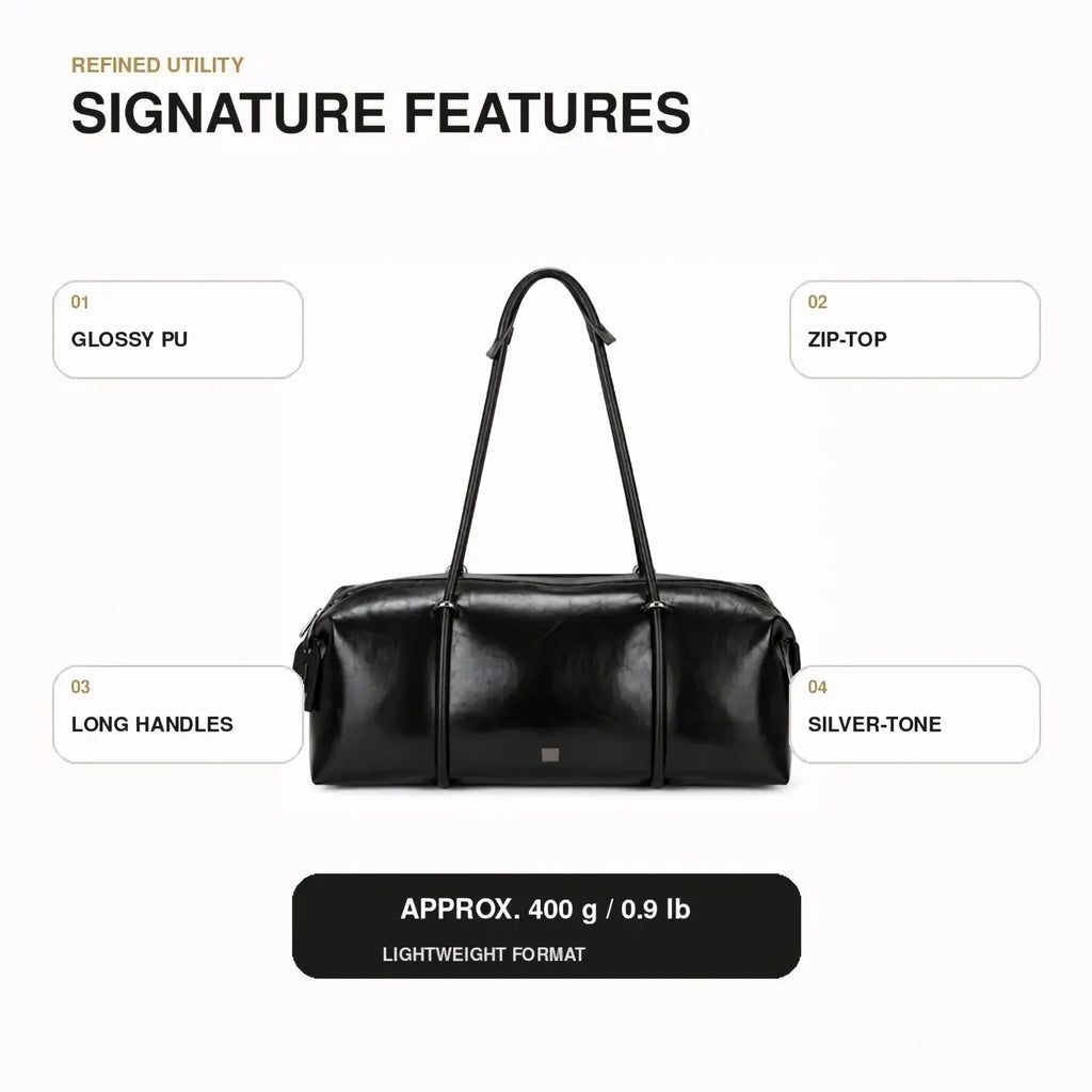 Black pu leather travel duffel bag gym tote in glossy finish with long handles and silver-tone zipper closure