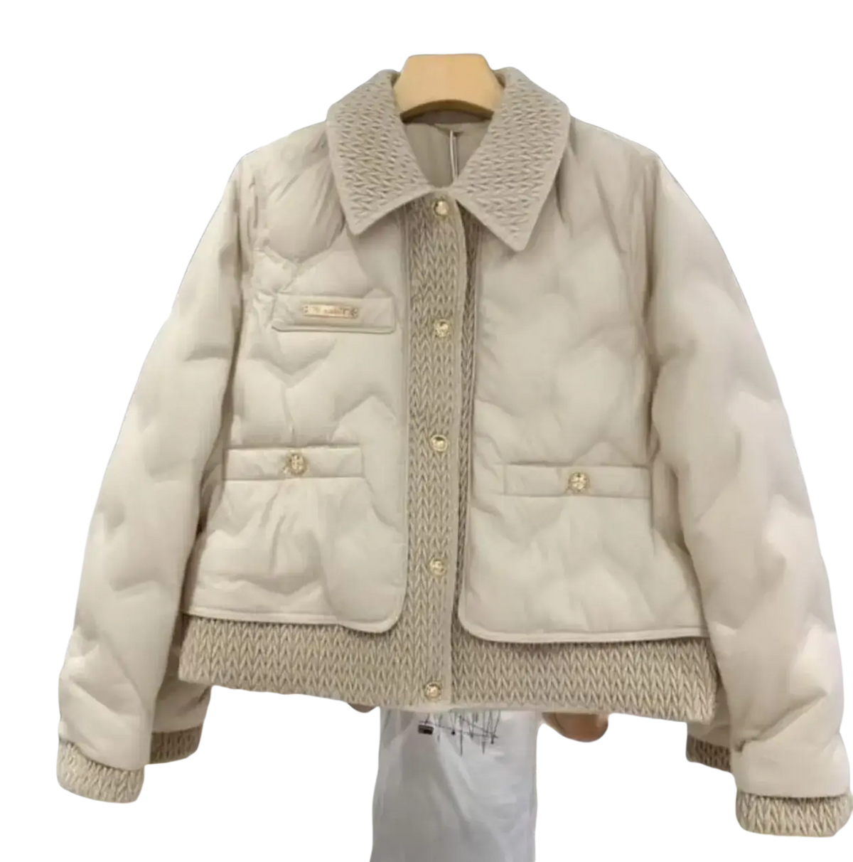 Black quilted cotton padded winter jacket with cream-colored quilted fabric and textured knit collar cuffs and front placket