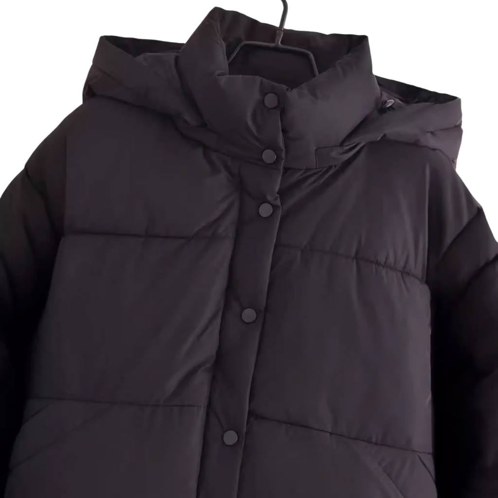 Black quilted hooded puffer coat with front button closure designed for warmth and style in cold weather