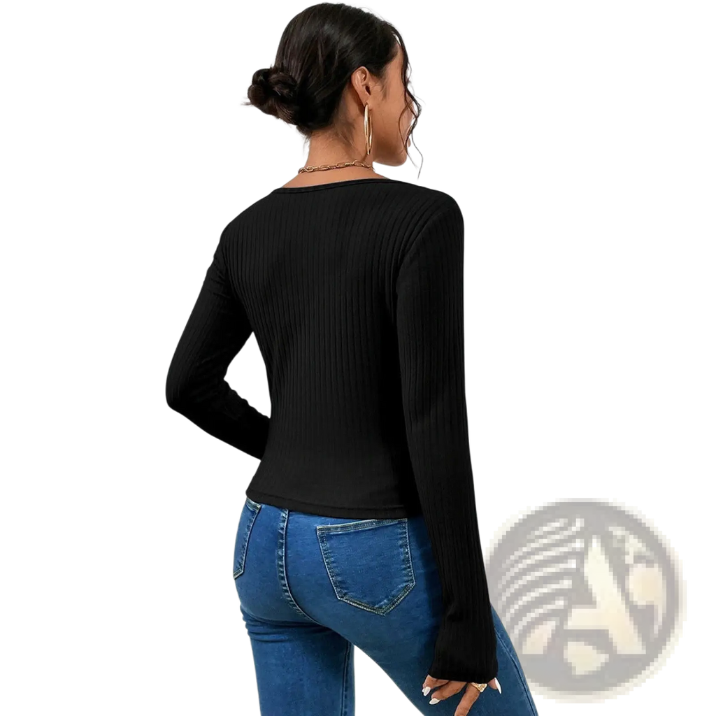 Black ribbed crisscross long sleeve top featuring textured fabric and a stylish front design for casual wear