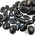Black river rocks 2-3 inch polished pebbles with a smooth glossy finish weighing 38lbs for landscaping use
