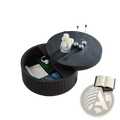 Black round coffee table with storage, hinged lid, slatted base, and textured surface for functional decor