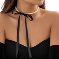 Black satin and pearl ribbon choker jewelry set featuring a white pearl string and bow tied at the front