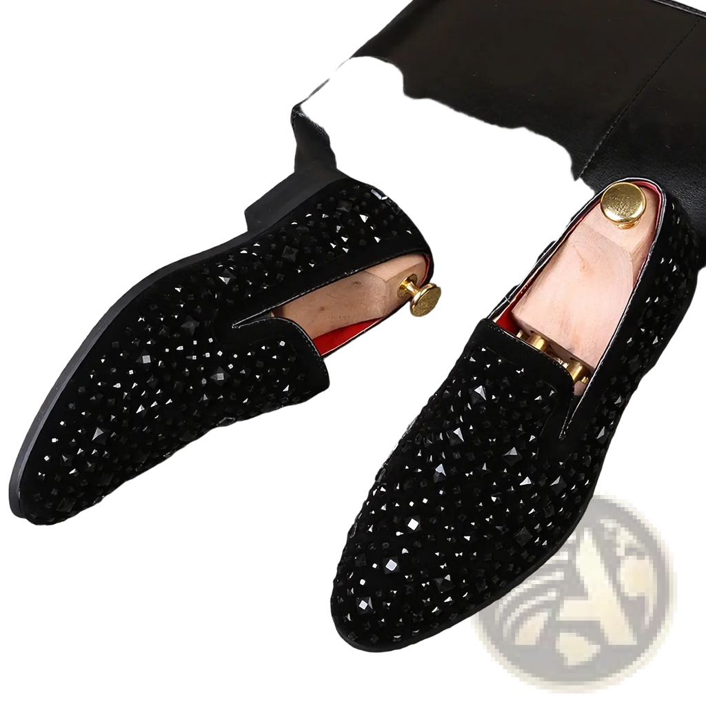 Black sequin pointed toe loafers in black suede with sparkling rhinestones and gold-toned metal accents on the insole
