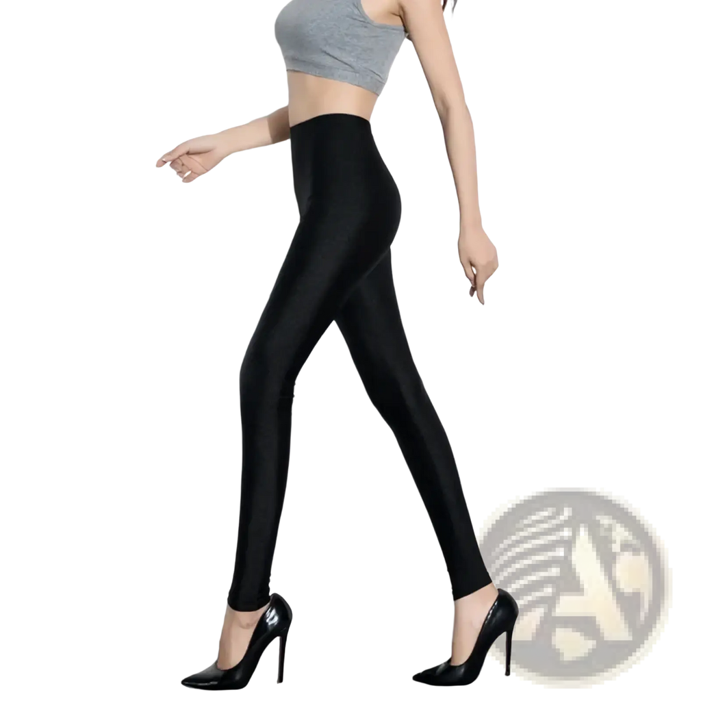 Black shiny stretch leggings for women featuring high-waisted design and smooth form-fitting texture