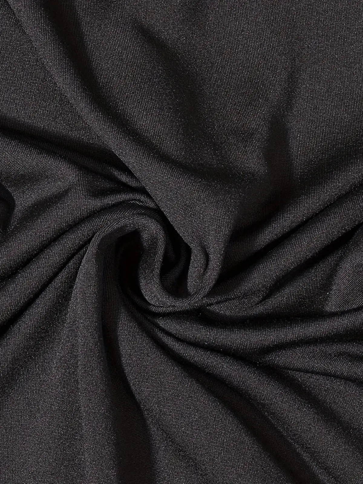 Black short sleeve bodycon jumpsuit made of black textured fabric with subtle sheen and fine uniform weave