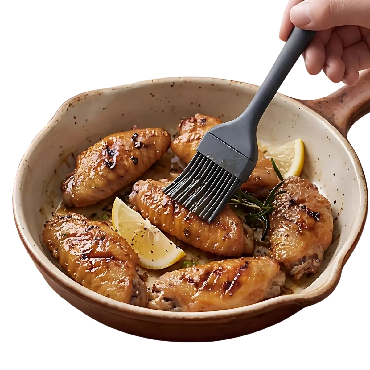Gray silicone basting brush with sturdy handle from black silicone kitchenware set glazing cooked chicken wings