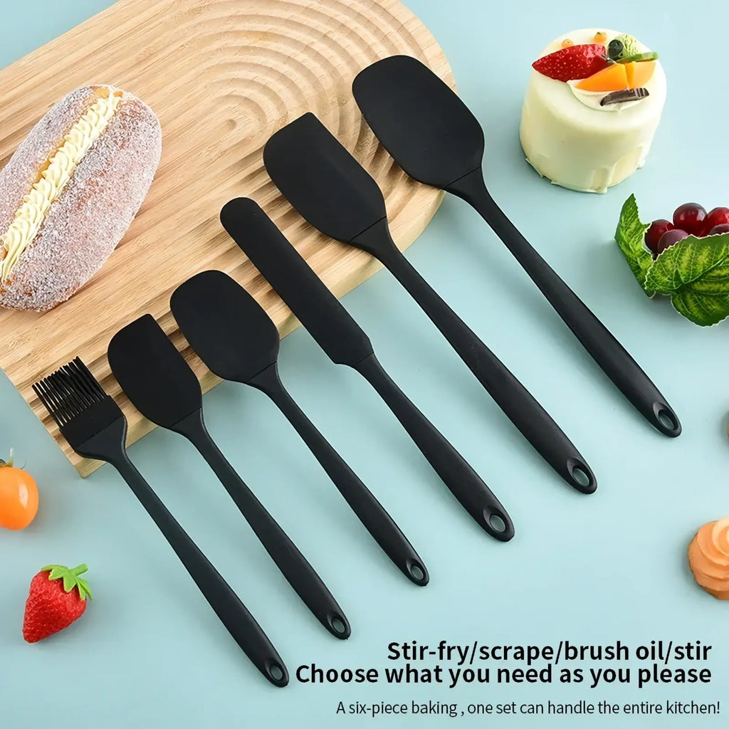 Set of six black silicone kitchenware utensils for baking and cooking including stirring, scraping, and brushing tools