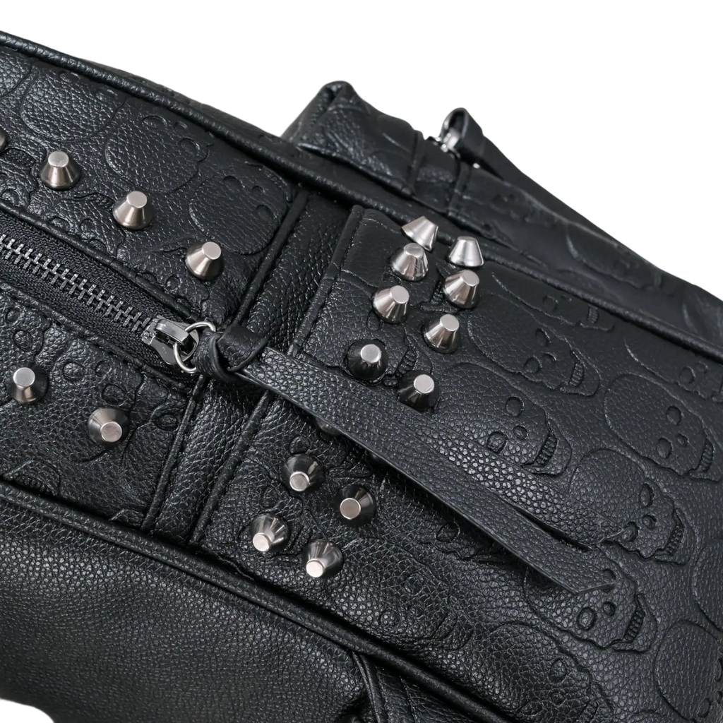 Black studded skull leather commute backpack featuring embossed skull pattern and silver-toned studs crossbody bag