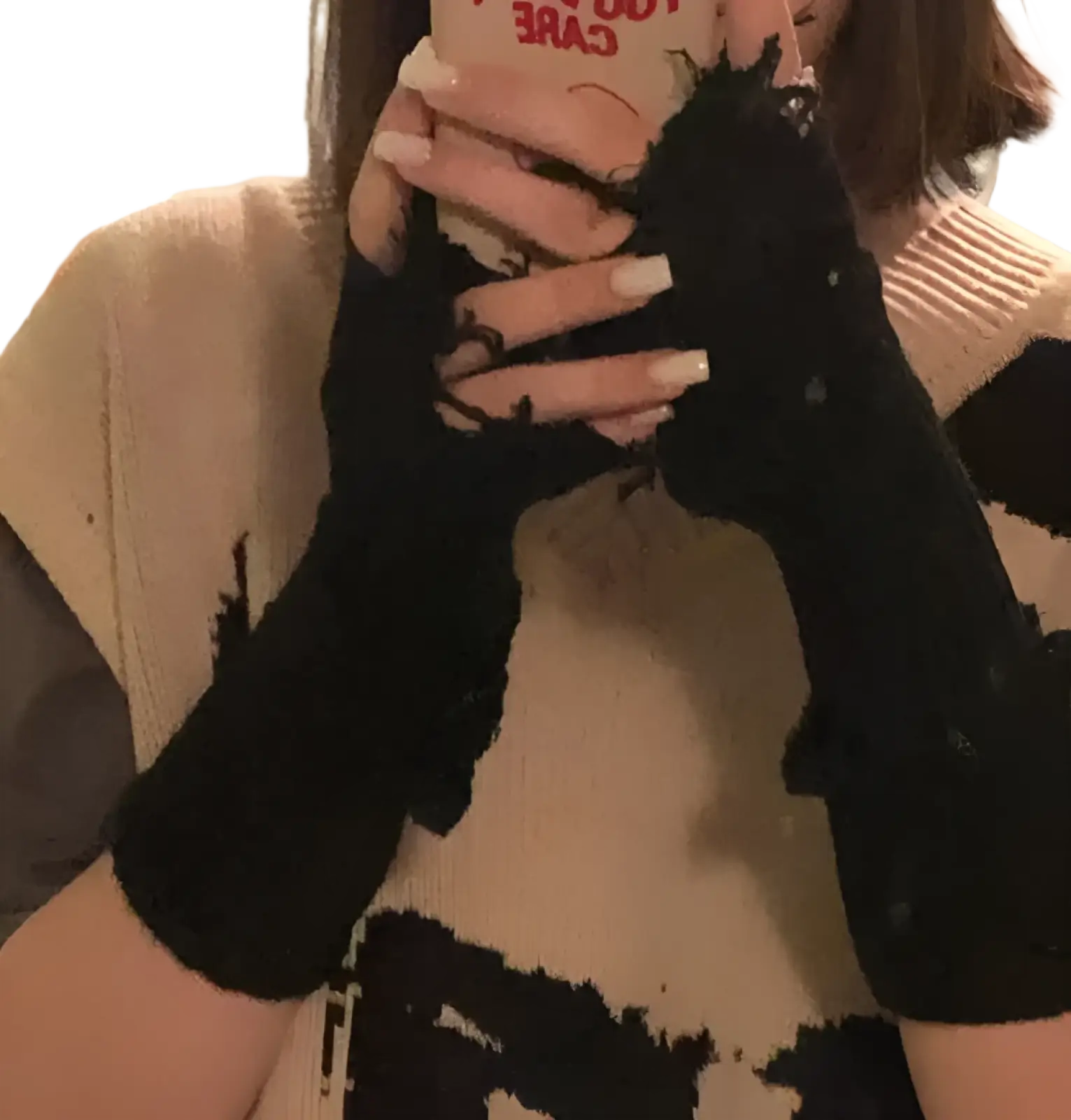 Black tattered knit fingerless gloves unisex showing the back side with distressed frayed and ripped texture