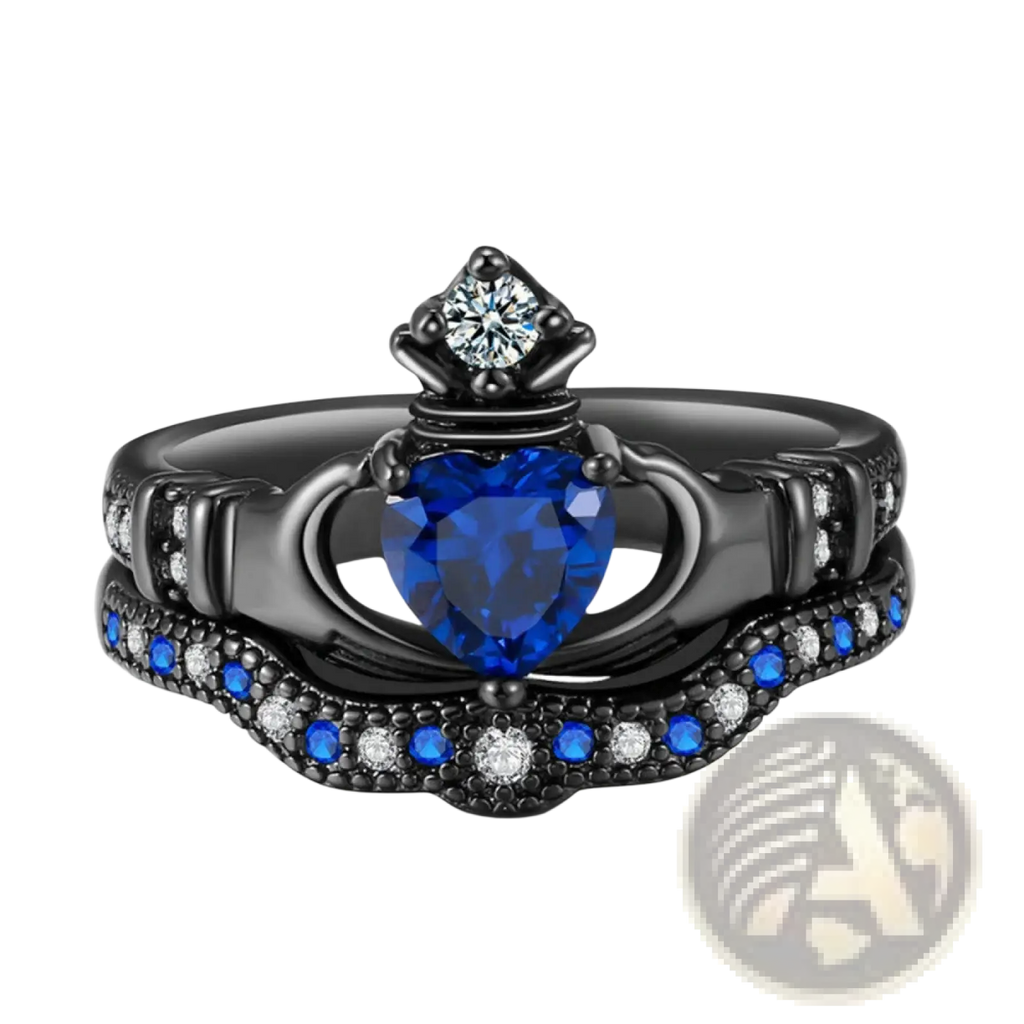 Black titanium claddagh engagement ring set with a heart-shaped blue sapphire and smaller blue and clear stones