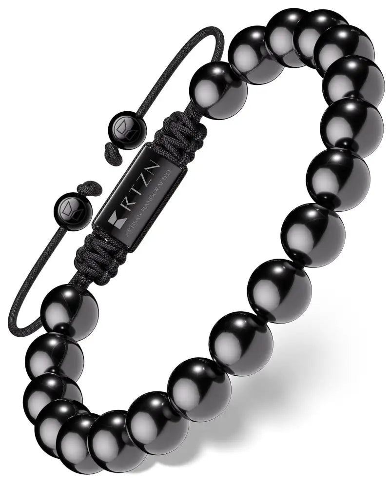 Aaa grade black tourmaline Bali beaded bracelet with black spherical beads on a black cord and metal clasp