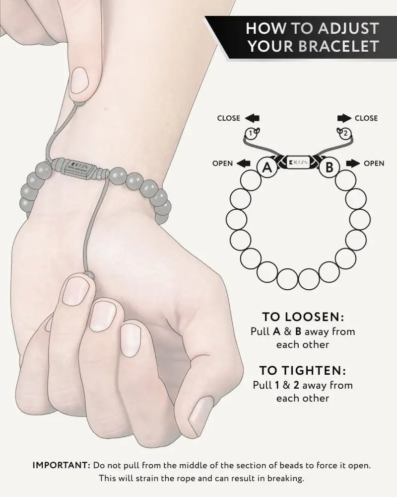 Aaa grade black tourmaline Bali beaded bracelet in gray with a central metal clasp and adjustable sliding ends