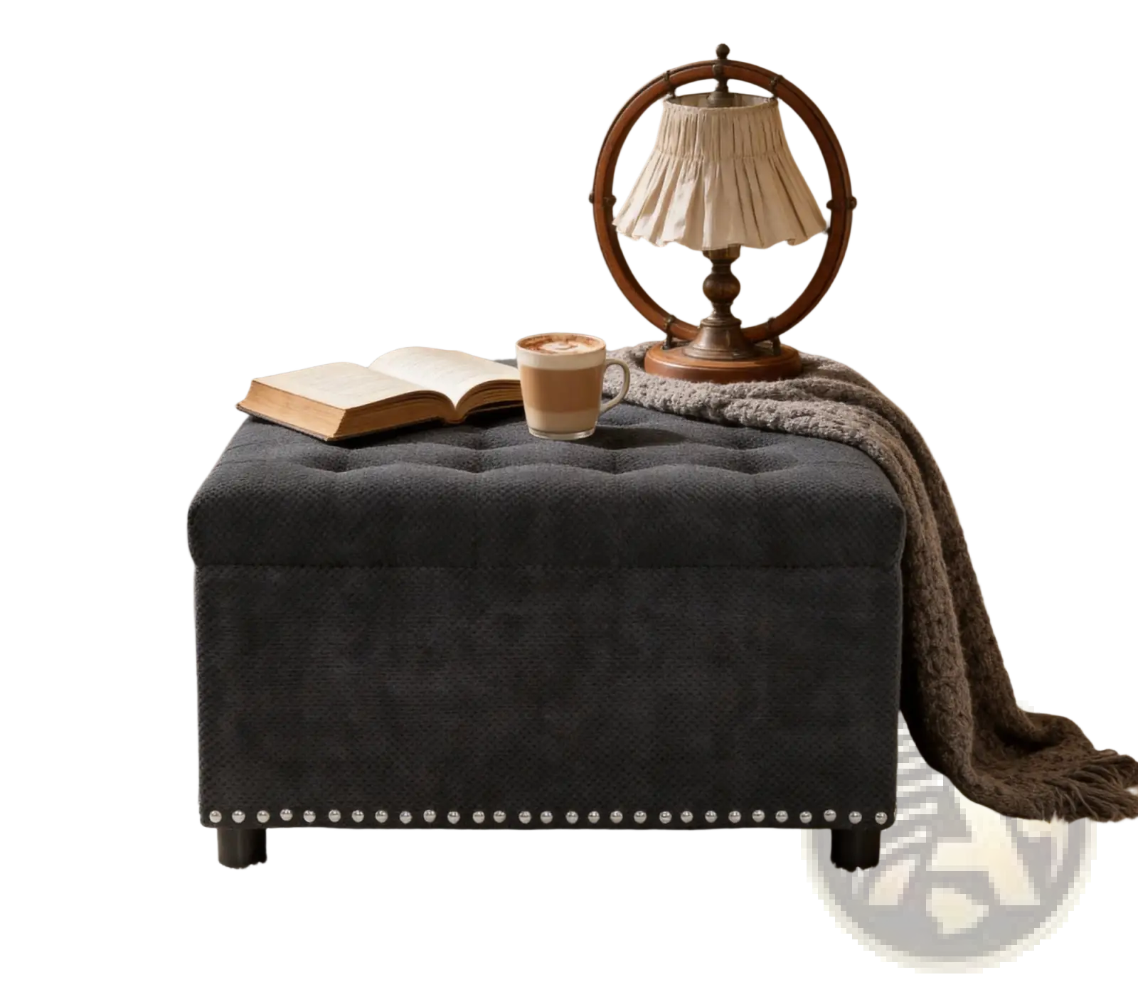 Black tufted storage ottoman in dark gray fabric with decorative nailhead trim along the base for storage use